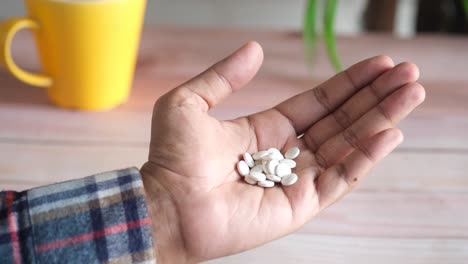 hand holding pills