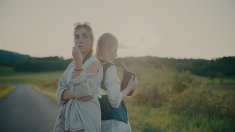 female friends standing together on road