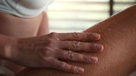 woman getting a leg massage and scrub