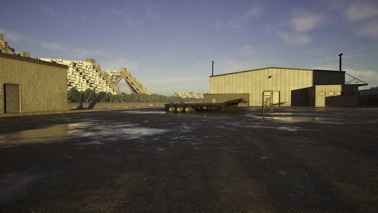 Deserted warehouse site under snowy distant peaks and gray skies