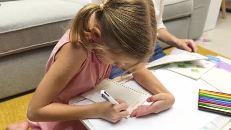 girl doing homework at home