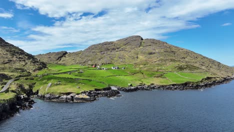 Drone-landscape-the-rugged-terrain-of-West-Cork-Ireland,-Cods-Head-Drive-winds-its-way-through-stunning-landscape-of-the-Beara-peninsula-in-summer