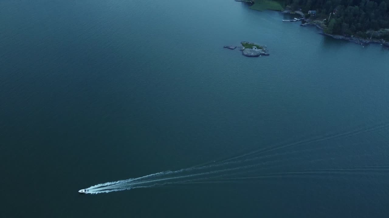 Boat sailing on the sea near an island