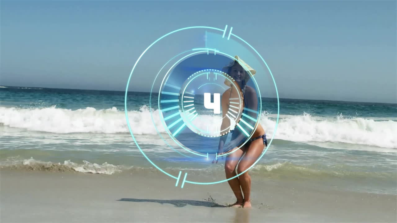 At beach, woman in swimsuit relaxing with countdown animation overlay
