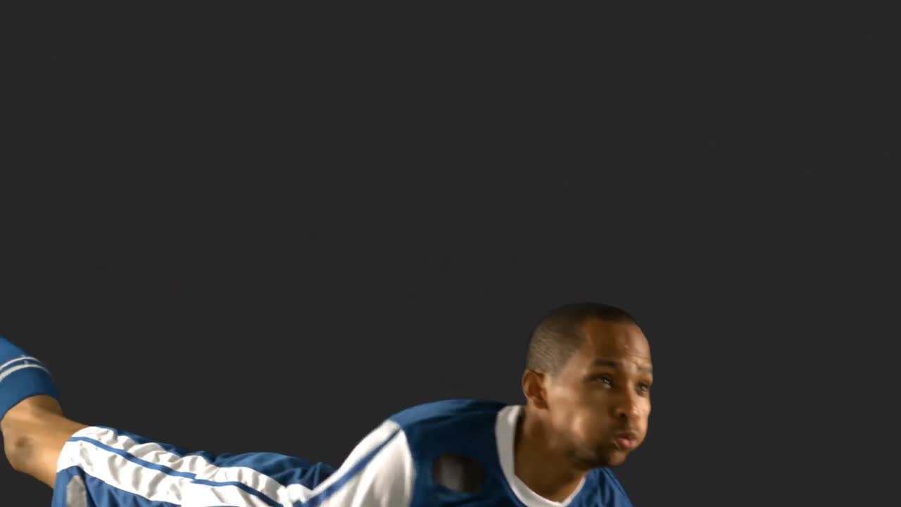 Football player heading the ball