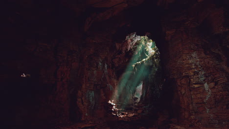 a mysterious cave illuminated by a beam of light