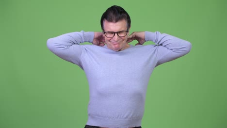 senior handsome man having neck pain