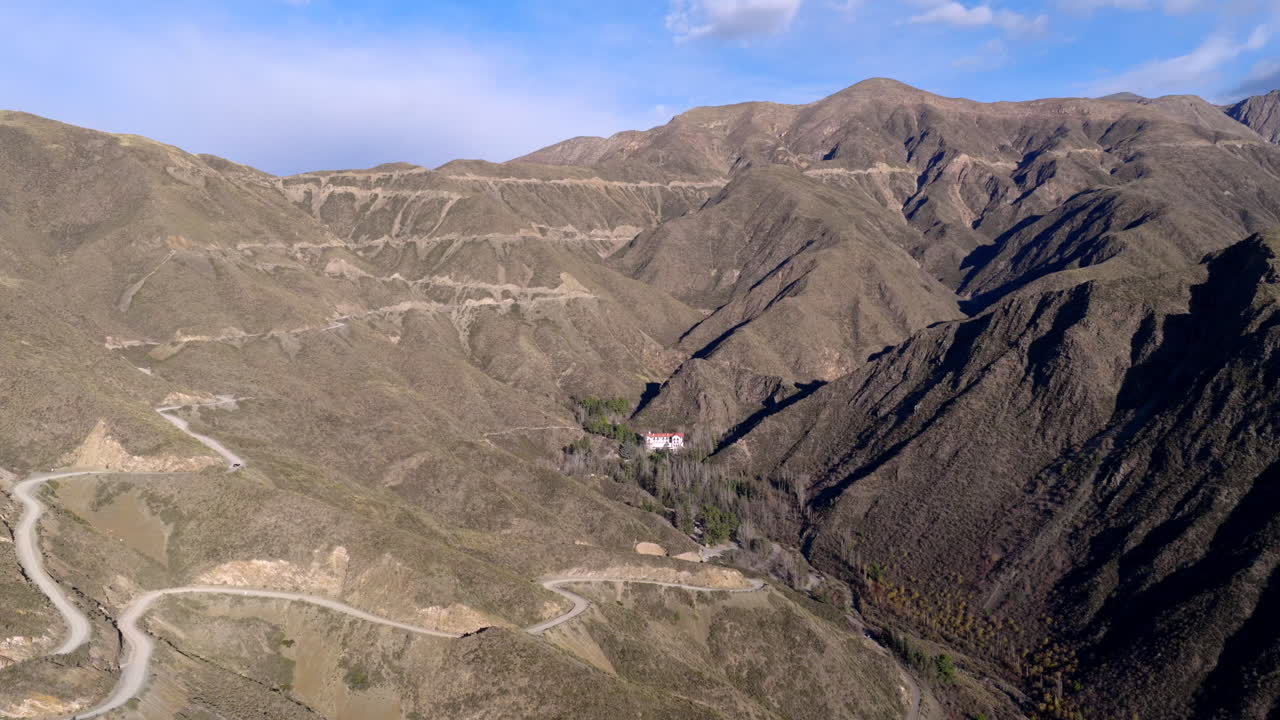 Steep switchbacks of Ruta Provincial 52, called Caracoles de Villavicencio, traverse arid Andean slopes in Mendoza province’s nature reserve, offering dramatic scenery and historic mountain access