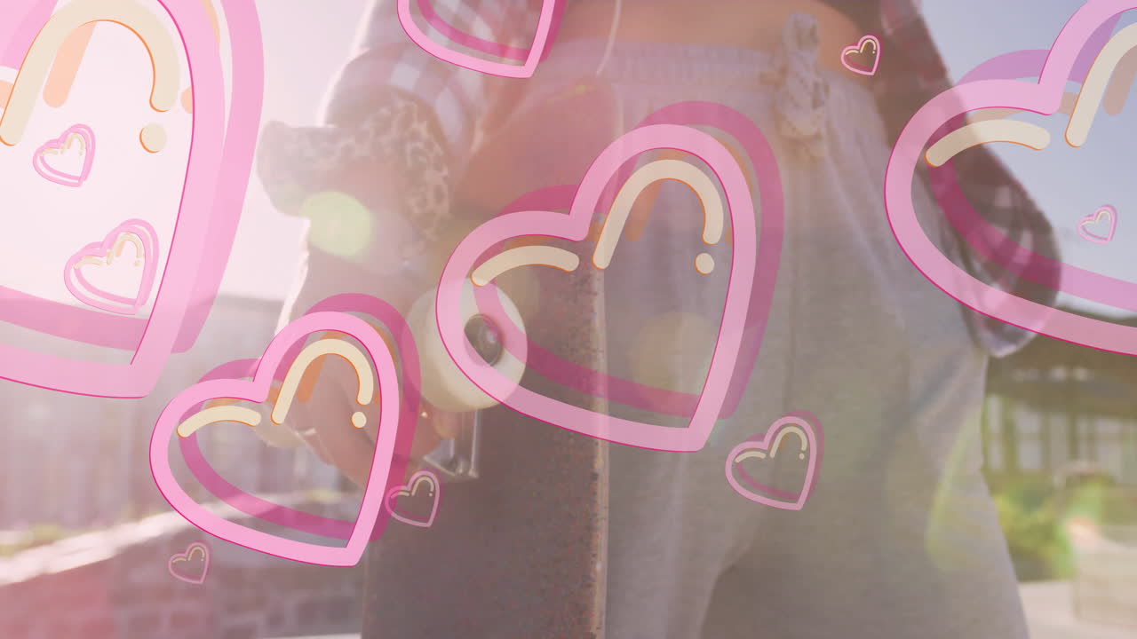 Holding skateboard outdoors, person with pink heart animation in background