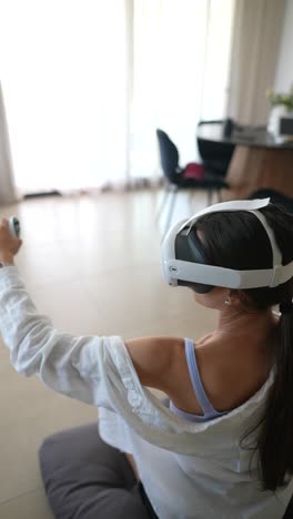 woman playing a vr game at home