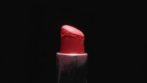 Used-red-lipstick-for-makeup-illuminated-with-bright-light