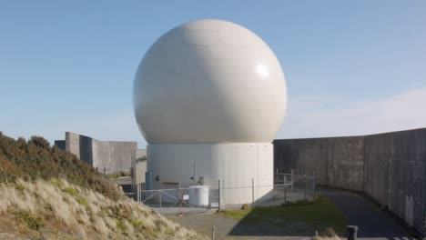 a radar dome surrounded by concrete walls