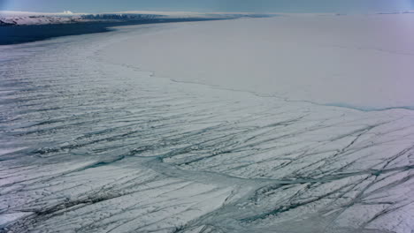 vast expanse of frozen landscape with patterned sea ice