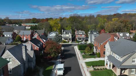 suburban street with brick houses and clear blue skies