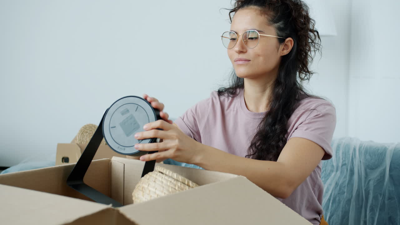 Woman Unpacking Moving Boxes