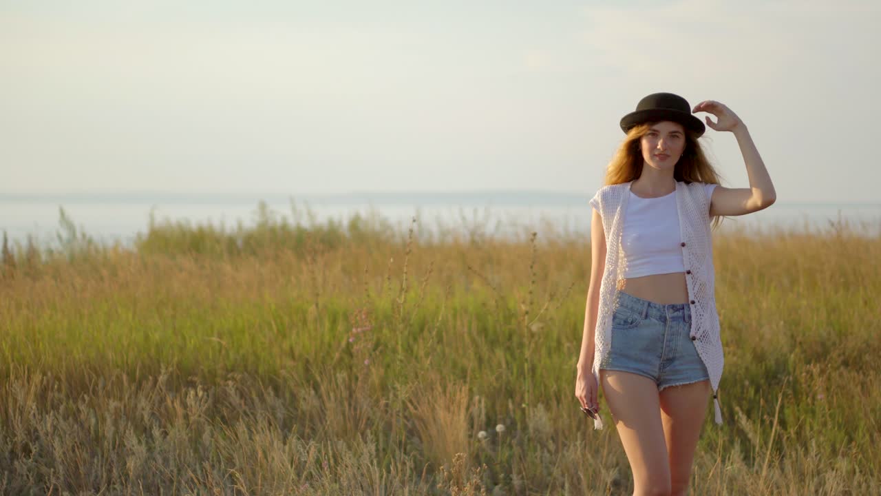 Woman enjoying a summer day in a field
