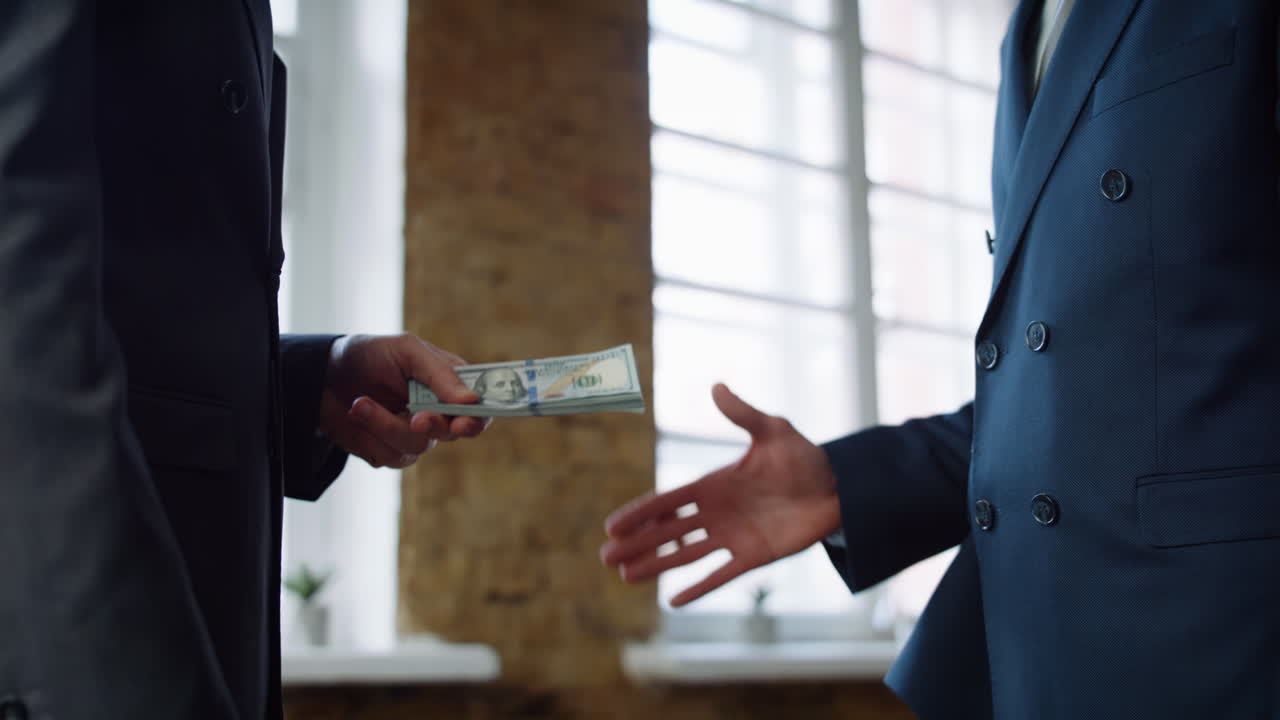 Businessman giving money partner at office meeting close up. Man receiving bribe