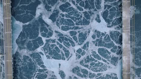 top down aerial footage of chemical water mixing about