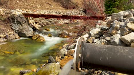 long exposure time lapse of a river flowing down a mountainside - white water is smooth wispy and surreal