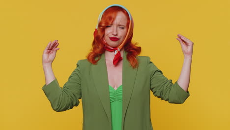 redhead woman showing nonsense hands gesture, gossips, empty fake promises, liars, yellow background