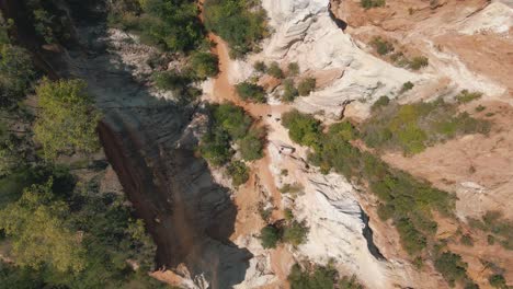 stunning drone footage of people hiking through a canyon