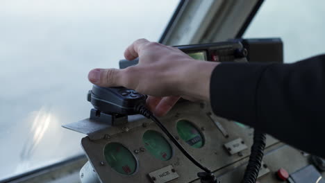 marine control panel and radio on a boat bridge