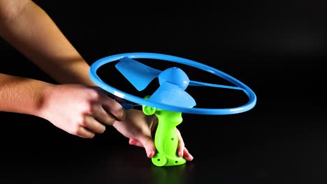 toy helicopter launched by pulling string