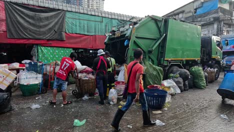 workers sorting and loading recyclables onto truck