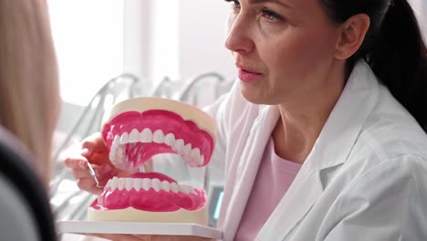Dentist and patient making a conversation during check up