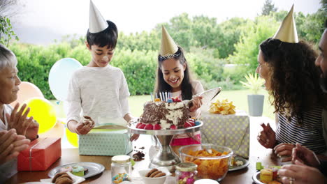 two young siblings celebrating their birthday