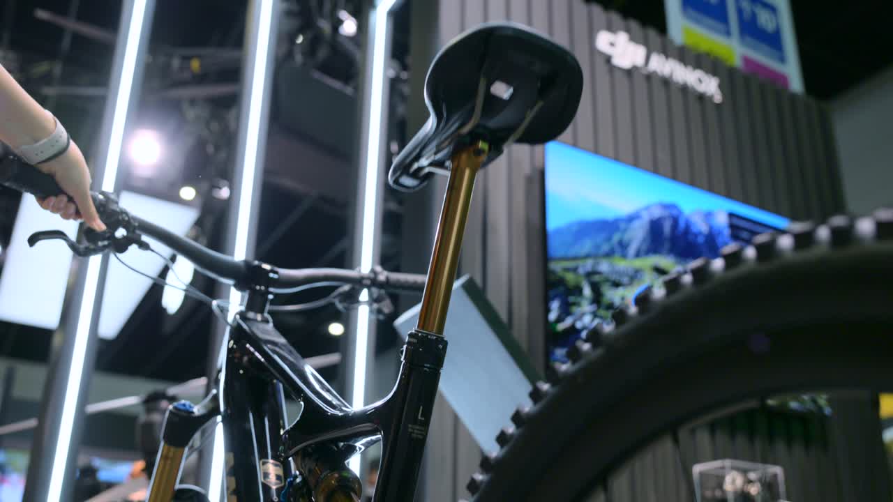 Close-up of an adaptive bicycle seat at IFA Berlin. The saddle adjusts height automatically for comfort and performance, showcasing advanced cycling technology in an exhibition setting