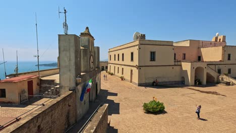 tourists enjoy views from a historic lookout