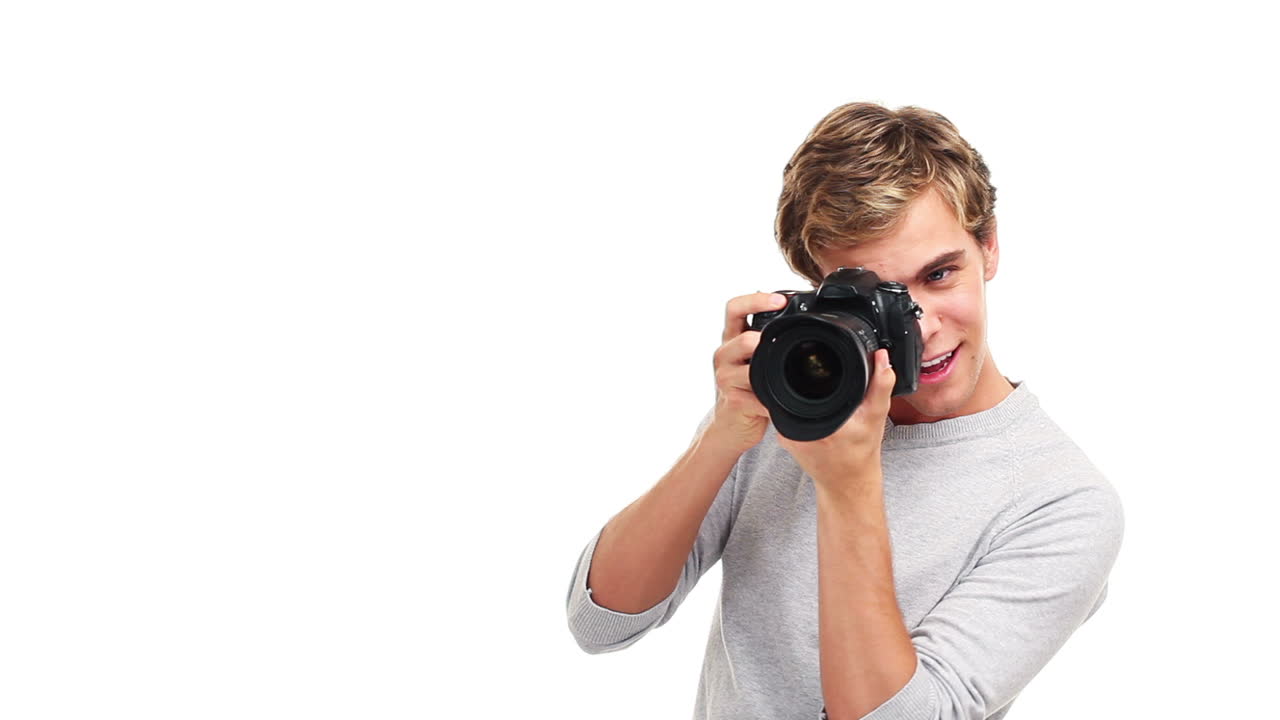 attractive photographer man taking photographs