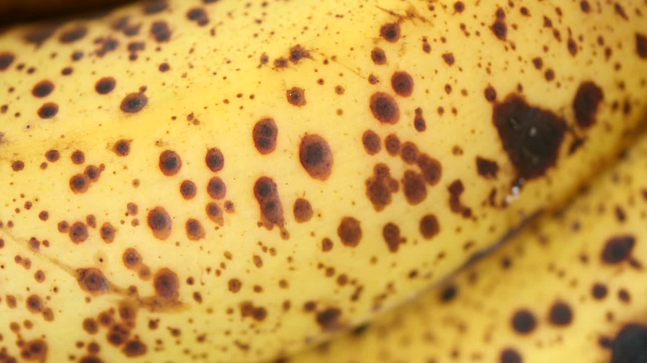Close-up of a banana peel with brown spots