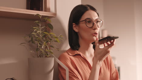 beautiful woman talking on speaker phone