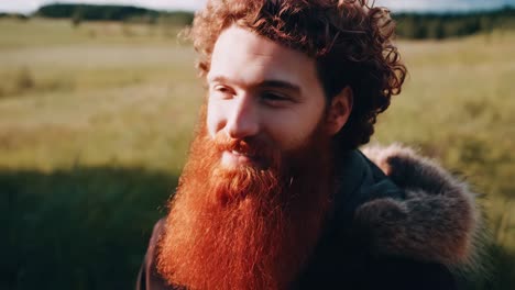 man with red hair and beard outdoors