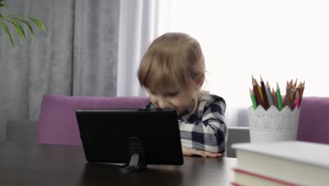 girl learning online lessons using digital tablet computer. distance education