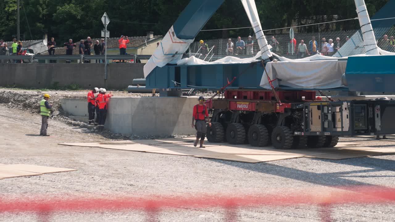 Heavy machinery and crew rig a bridge on a construction site in Tende, Breil-sur-Roya, South of France