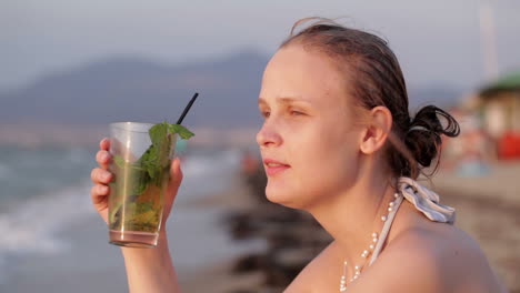 woman enjoying an evening cocktail