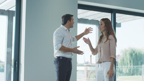 man and woman quarreling at home. wife and husband having conflict.