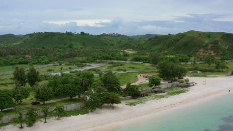 empty-white-sand-beach-coastline-at-Bukit-Merese-in-Lombok-on-cloudy-day,-aerial