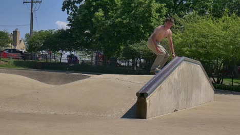 person does a skateboard grin on a rail