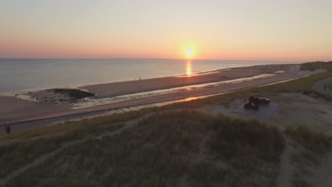 aerial: the beach between vlissingen and dishoek during sunset