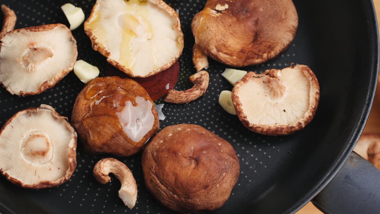 Sliced Shiitake Mushrooms Cooking in a Pan