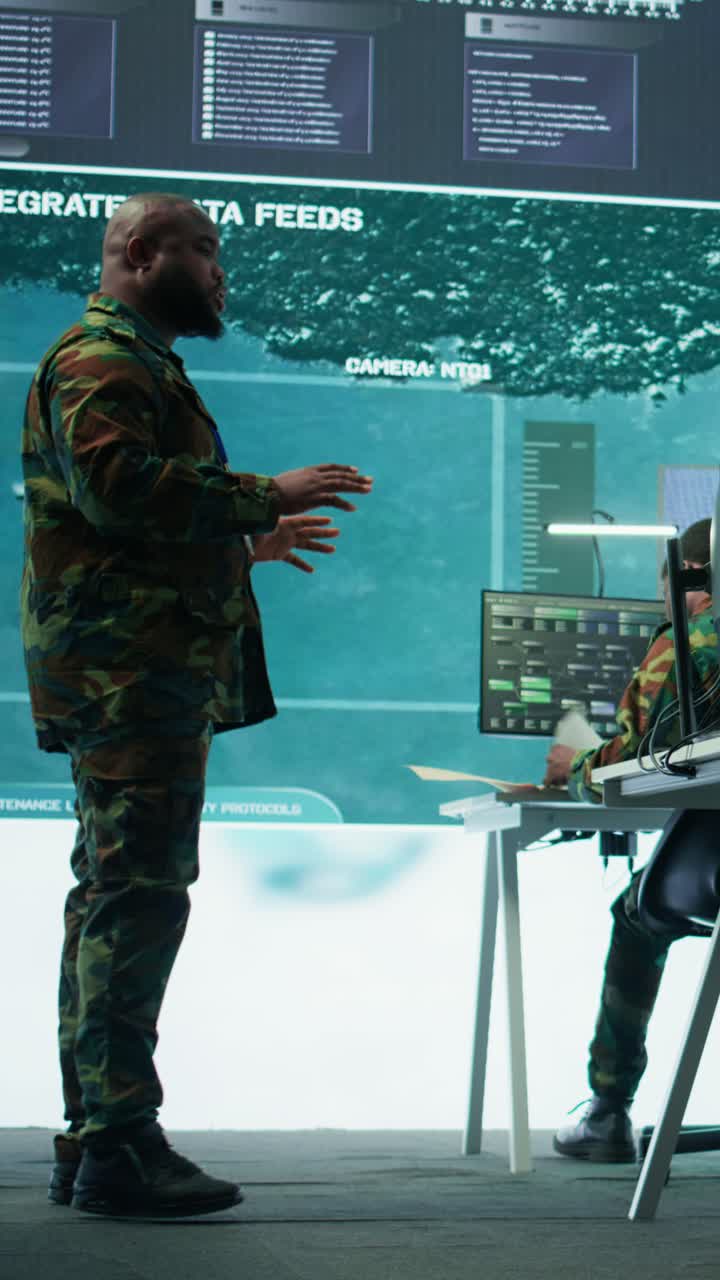Vertical Video Military team operating in a high tech command post control tower