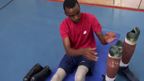 man exercising with prosthetic legs