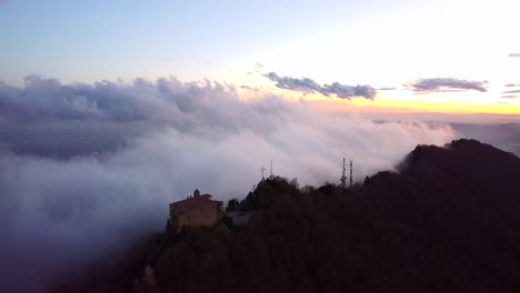 drone flying over clouds and mountains in spain