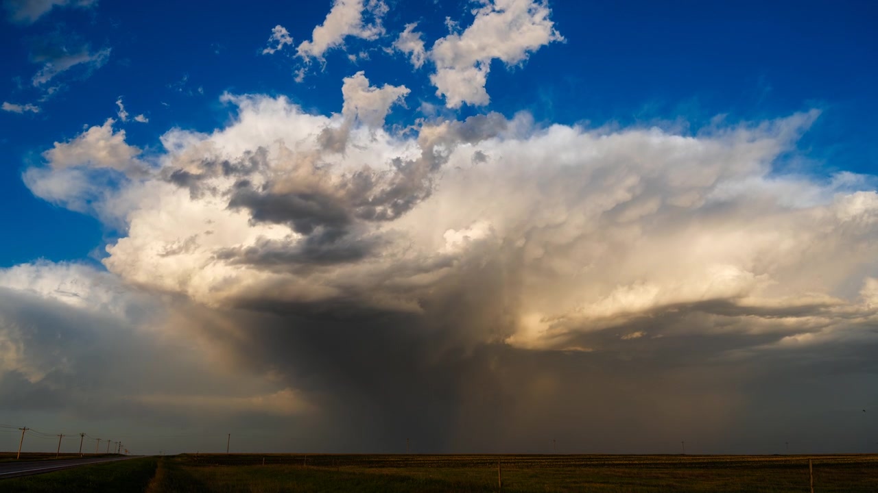 Atmospheric storm clouds fading at sunset after evening rainstorm