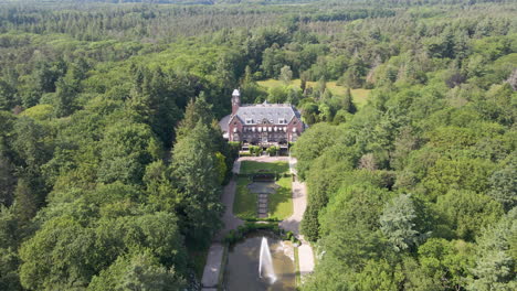 flying towards beautiful mansion in the middle of forest