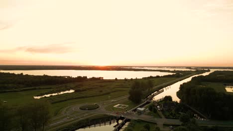 sunset over dutch canal system